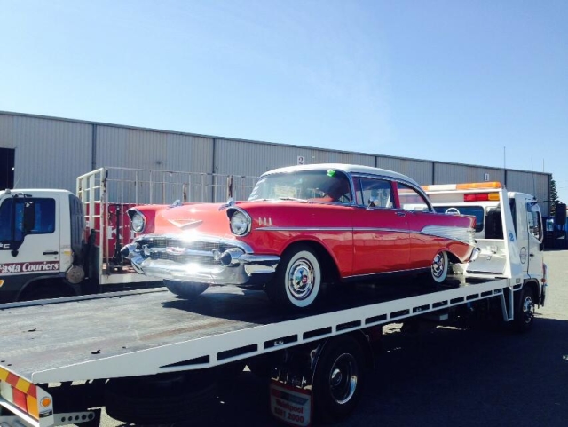 red classic car on a tilt tray in WA
