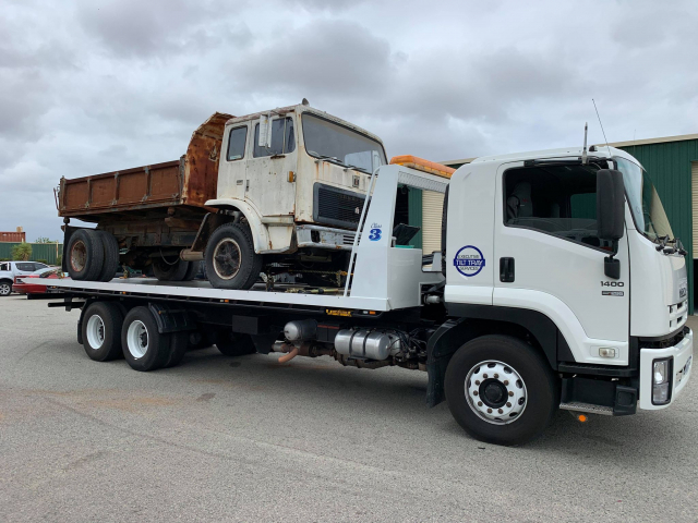 Tilt Tray Towing a Truck